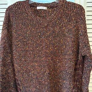 Beautiful multi color sweater with lacing down the side. Beautifully made. Small